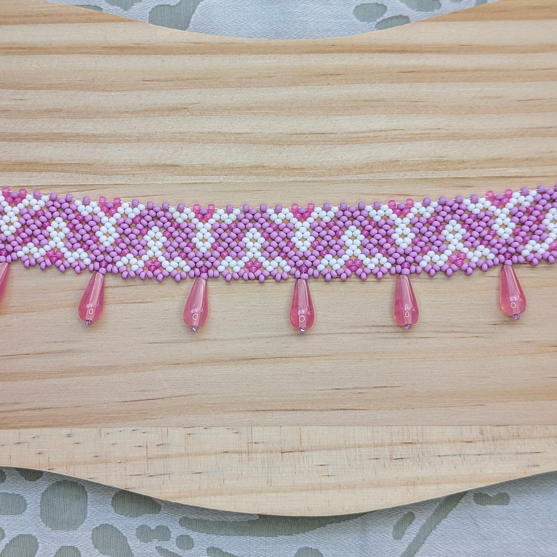 Pink collar necklace with traditional Ukrainian pattern