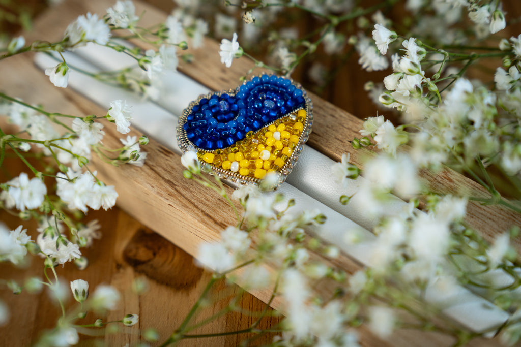 Heart-shaped pin in the colors of the Ukrainian flag