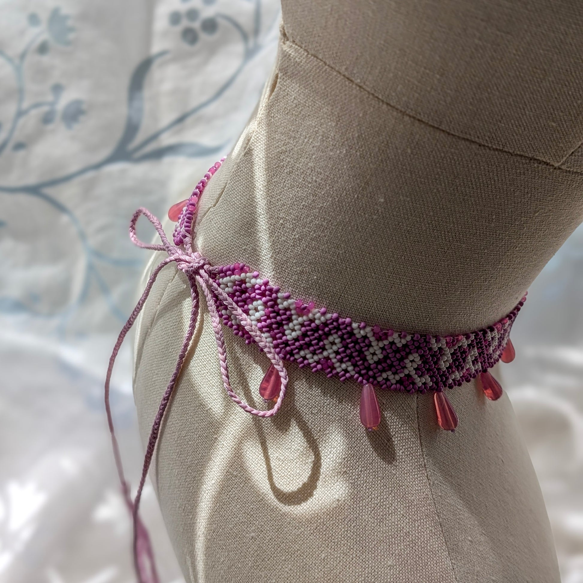 Pink collar necklace with traditional Ukrainian pattern