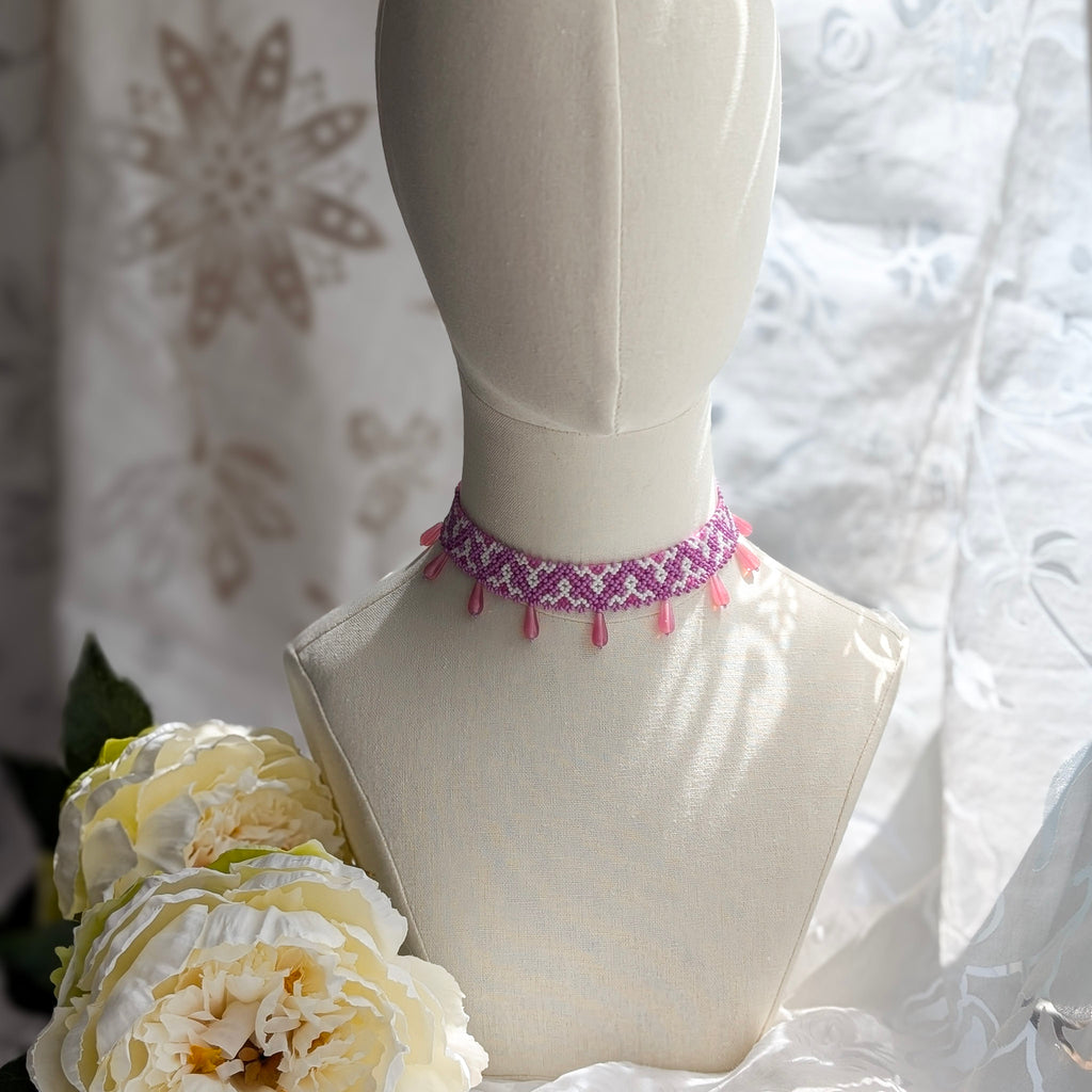 Pink collar necklace with traditional Ukrainian pattern