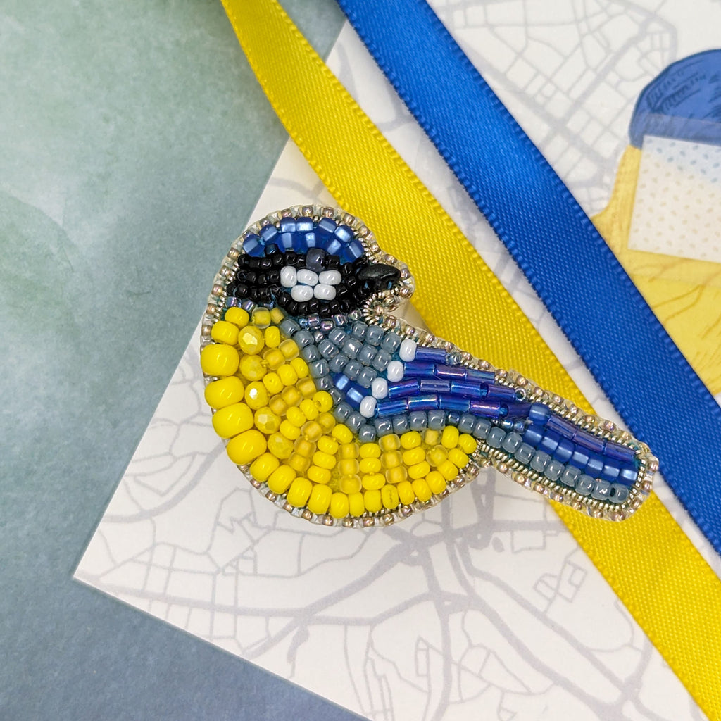 Bird pin in the colors of the Ukrainian flag