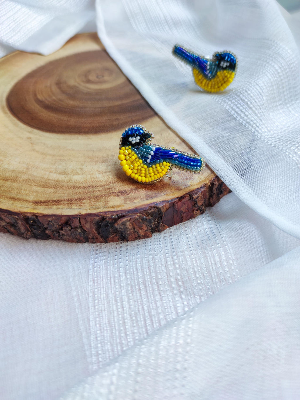 Bird pin in the colors of the Ukrainian flag