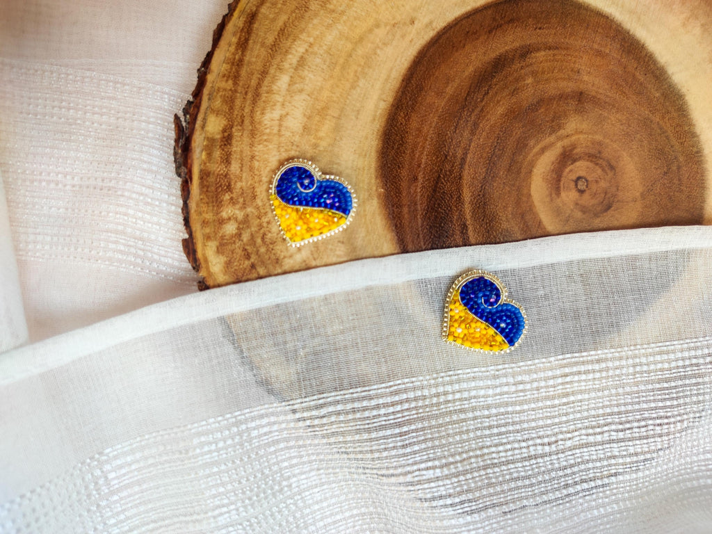 Heart-shaped pin in the colors of the Ukrainian flag