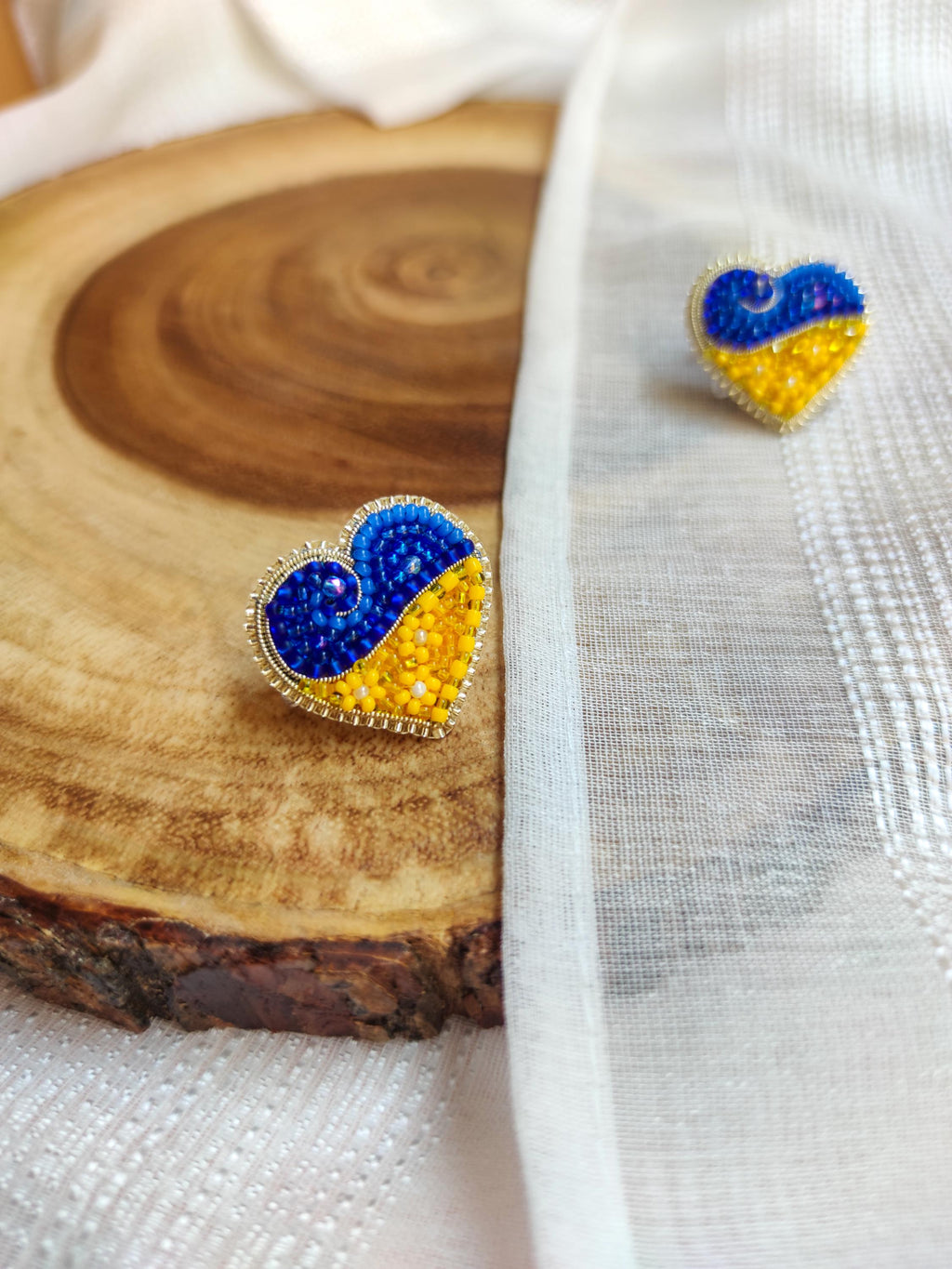 Heart-shaped pin in the colors of the Ukrainian flag