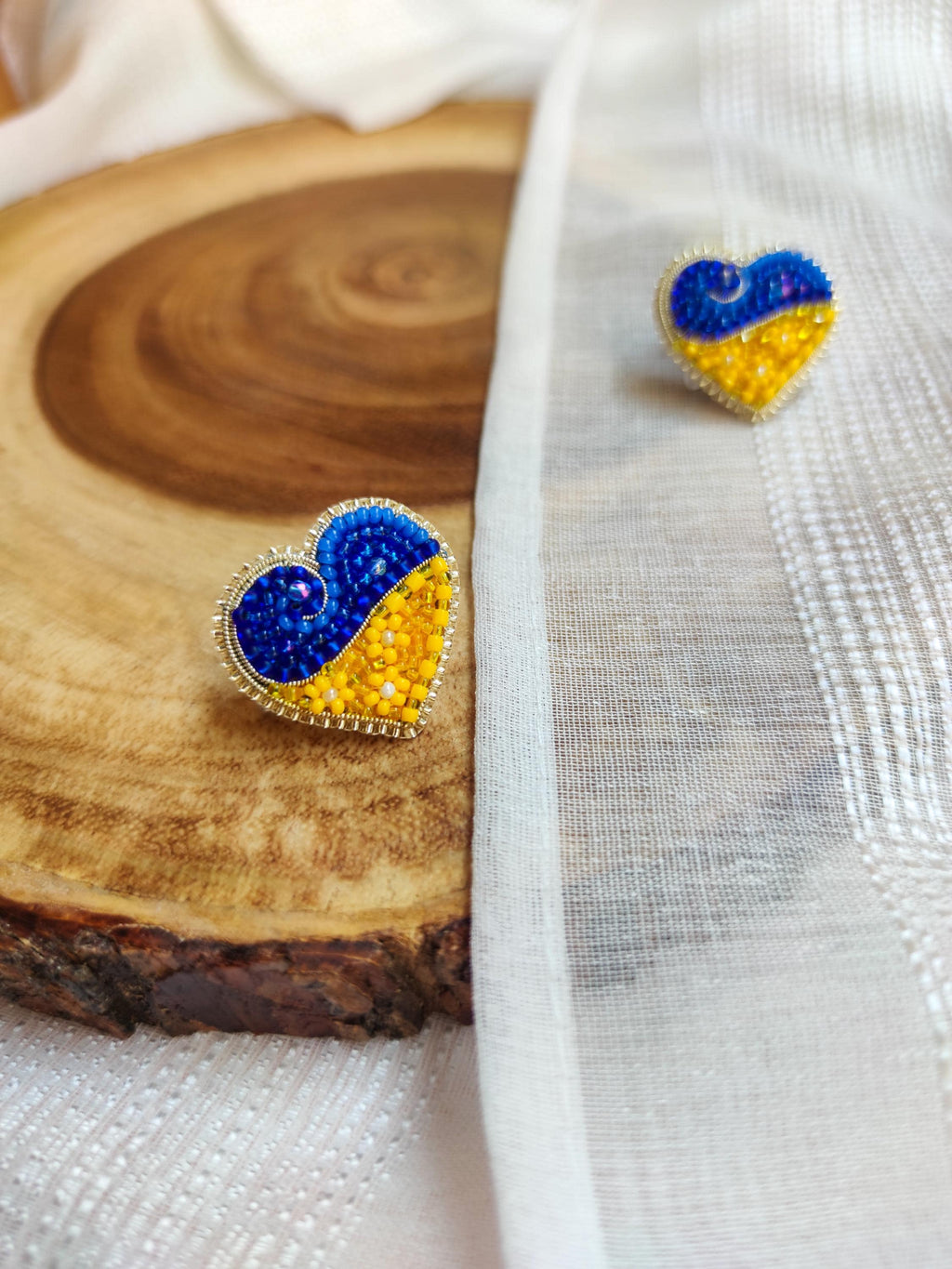 Heart-shaped pin in the colors of the Ukrainian flag